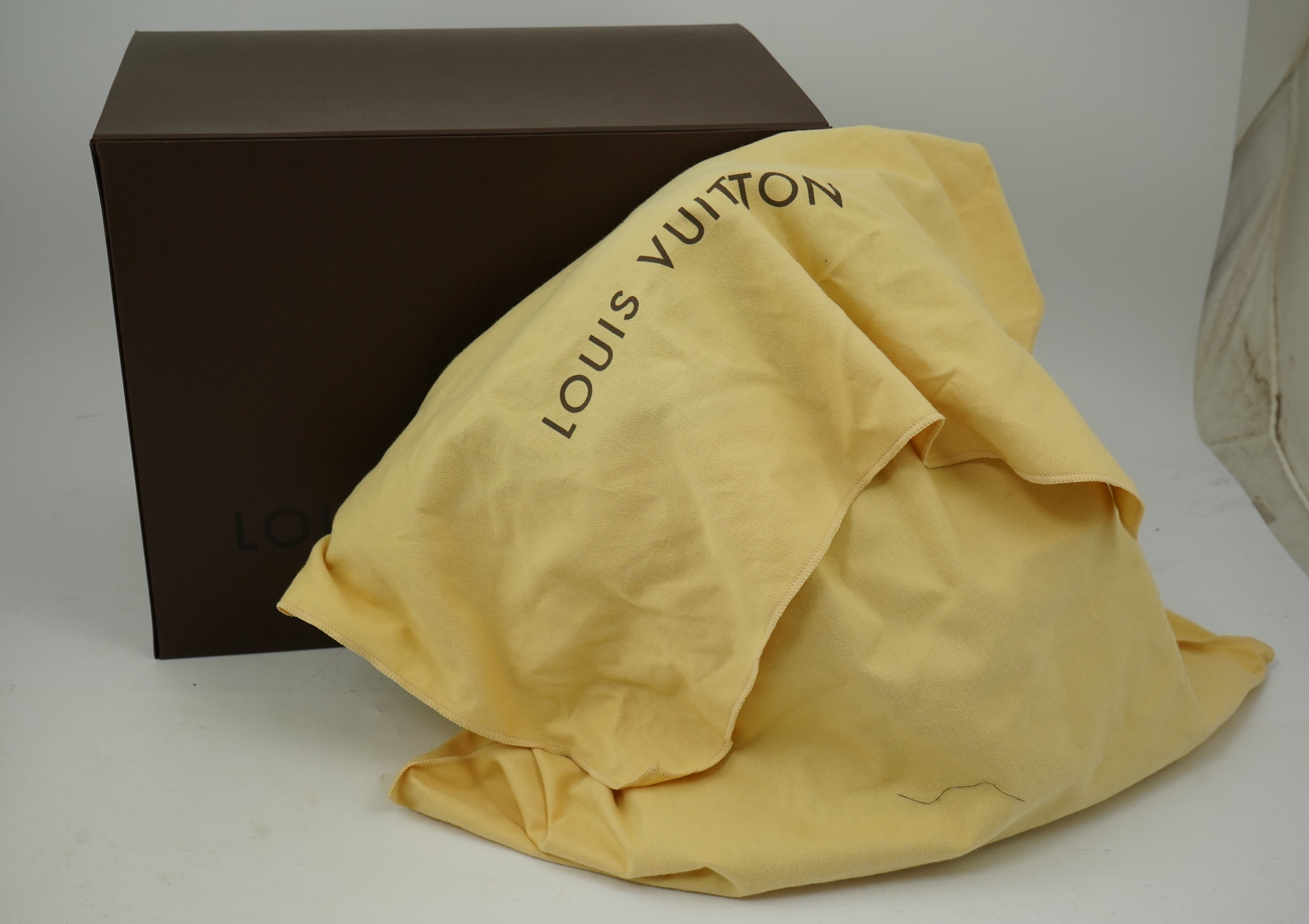 A Louis Vuitton brown monogram canvas with natural cowhide trim and gold-toned hardware